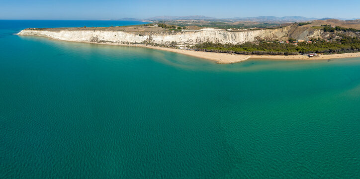 Panoramic aerial view of Eraclea Minoa beach, located in province of Agrigento, Sicily, Italy. It's characterized by a high white cliff. It's a beautiful sunny day. The Mediterranean sea in foreground