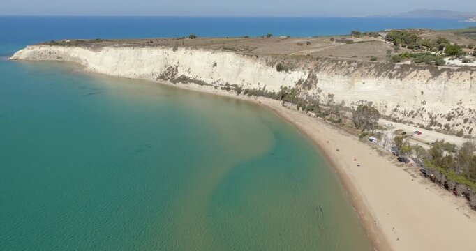Aerial view of Eraclea Minoa beach, located in province of Agrigento, Sicily, Italy. It's characterized by a high white cliff. It's a beautiful sunny day. The Mediterranean sea in foreground.