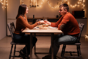 Couple in love Romantic date at night at home. couple celebrating Valentine's day.