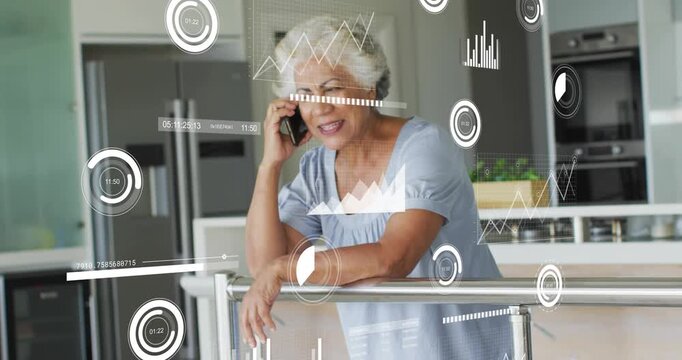 Senior woman railing on phone starting call causing finance charts floating shifting around smiling