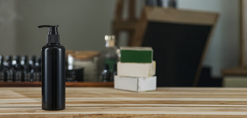 A blank no label shampoo bottle on wooden table with background of many beauty treatments