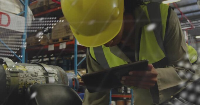 Woman technician in warehouse answering tablet alert, inspecting unit, viewing map and code overlay - Powered by Adobe
