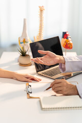 Consultation of a healthcare professional: In a bright, professional setting, a medical...