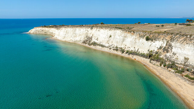 Aerial view of Eraclea Minoa coastline, located in province of Agrigento, Sicily, Italy. It's characterized by a high white cliff. It's a beautiful sunny day. The Mediterranean sea in foreground.