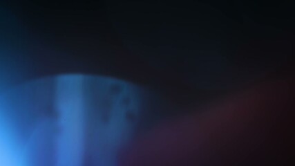 Abstract blue and purple light leaks and lens flares moving across a dark background, creating dynamic cinematic overlay and colorful light effects. - Powered by Adobe