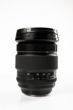 Black camera zoom lens on white background
