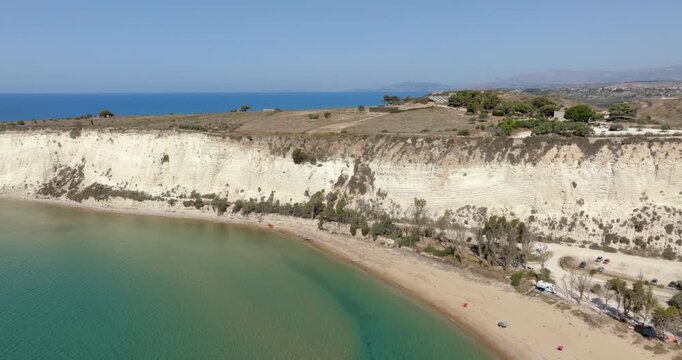 Aerial view of Eraclea Minoa coastline, located in province of Agrigento, Sicily, Italy. It's characterized by a high white cliff. It's a beautiful sunny day. The Mediterranean sea in background.
