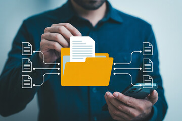 Man manages digital documents on his smartphone transferring files to a virtual folder for efficient organization and data management in a seamless cloud storage solution for productivity