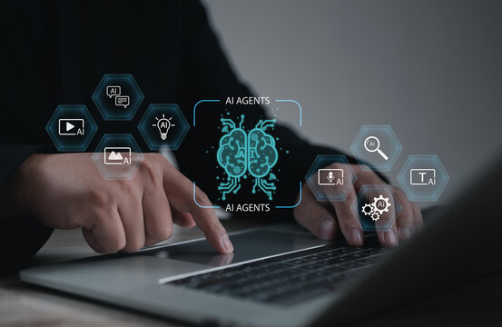 AI agents concept showing digital brain icons on a laptop screen. Modern artificial intelligence, automation, and machine learning technology for smart data processing and innovation.