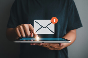 Person checks email on tablet with notification showcasing digital communication and technology emphasizing connectivity messaging and the convenience of mobile devices for staying informed