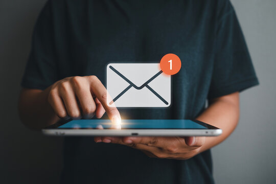 Person checks email on tablet with notification showcasing digital communication and technology emphasizing connectivity messaging and the convenience of mobile devices for staying informed