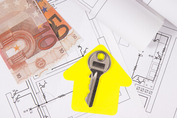 Euro banknotes, diagrams of electric installation, key and shape of house. Planning build or buy of home