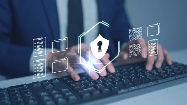 Business Cyber Security and Risk Management. A professional manages company security protocols on a digital device, symbolizing the protection of sensitive business assets, client data, and critical i