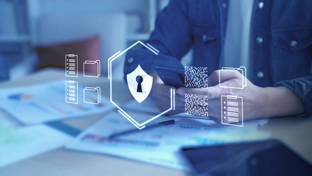 Business Cyber Security and Risk Management. A professional manages company security protocols on a digital device, symbolizing the protection of sensitive business assets, client data, and critical i