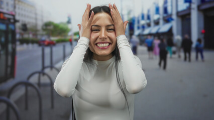 Fototapeta premium Woman smiling on city street with joyful expression showcasing vibrant urban scene and dynamic energy of outdoor lifestyle