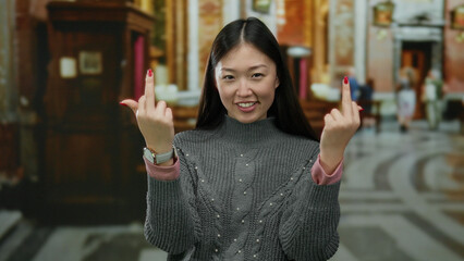 Woman making gesture indoors with a playful expression in a church setting, blending traditional...