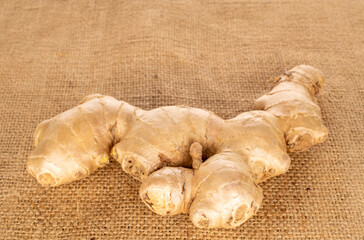 Ginger root on jute cloth, macro.