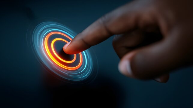 Human finger interacts with a glowing digital interface element in a dark setting.