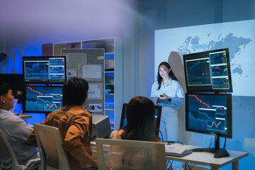 young Asian software development manager leads a late-night office discussion with his executive team, mentoring developers and analyzing source code to guide programming and project development	