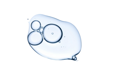 Close-up of a clear liquid droplet with three contained bubbles, set against a black backdrop