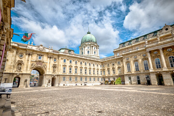 Obraz premium Budapest, Hungary - July 28, 2025: Exteriors of the Budapest Castle — a restored Neo-Renaissance building complex in Budapest, Hungary, located on the Buda side of the Danube 