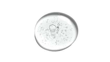 A clear gel drop with tiny bubbles, isolated on a stark black background