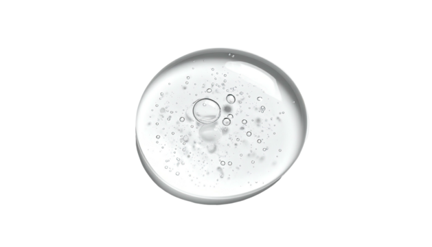 A clear gel drop with tiny bubbles, isolated on a stark black background
