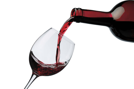 Elegant glass fills with rich red wine from bottle, evoking celebration, and sophisticated taste