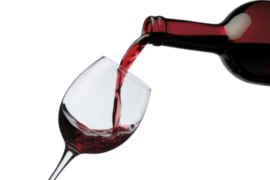 Elegant glass fills with rich red wine from bottle, evoking celebration, and sophisticated taste