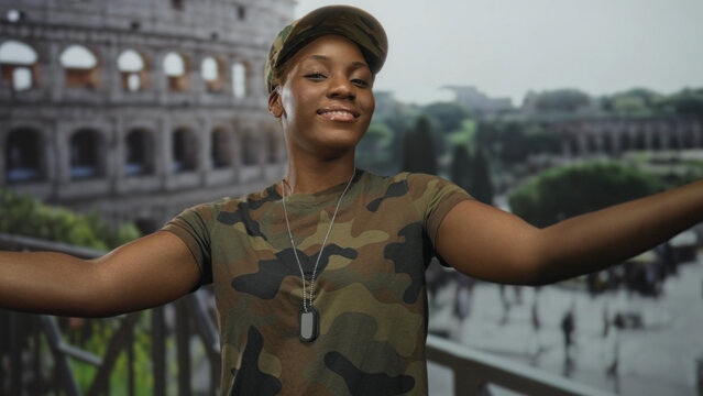 Young african american woman in military camouflage uniform opens arms wide at roman building overlooking ancient ruins; pride duty.