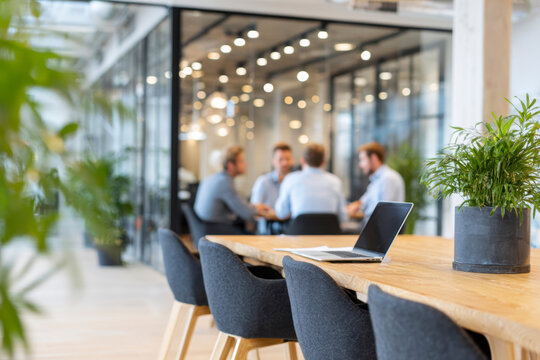 Team meeting in a modern office with open space and stylish decor at midday