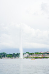 A fountain in Lake Geneva in the city of Geneva, Switzerland The sky is cloudy; the picture was taken in high resolution.