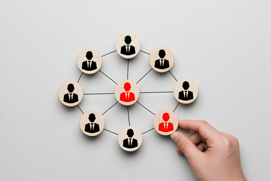 Business Network Concept with Wooden Circles and Hand Selecting Leader – Teamwork and Leadership Connection