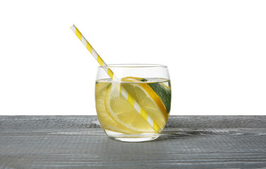 Refreshing water with lemon and mint in glass on grey wooden table