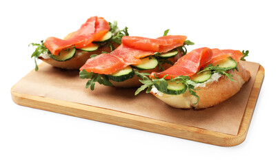 Tasty bruschettas with salmon, cucumber and arugula isolated on white