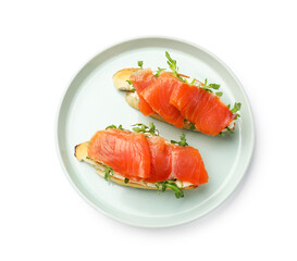 Tasty bruschettas with salmon and arugula isolated on white, top view