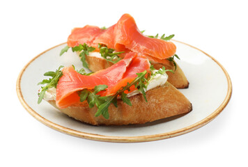 Tasty bruschettas with salmon and arugula isolated on white