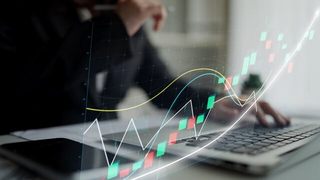 A business professional is focused on analyzing stock market trends using a laptop. Visualized graphs and data enhance the modern office atmosphere. Copula - Powered by Adobe