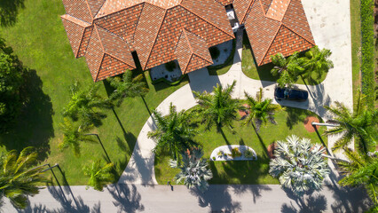 aerial overhead view of luxury estate driveway and beautiful tropical landscape 