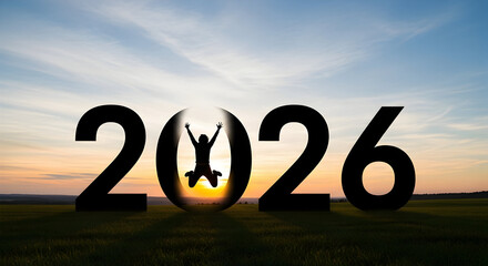 Silhouette of man jumping through the 0 in 2026 year on the background of the sunset sky
