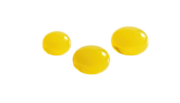 Three round, bright yellow objects against a stark black background, appearing glossy