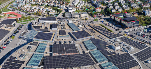 Aerial close-up of solar panel rooftops and eco-friendly buildings in Tirana’s eastern area, promoting renewable energy and green technology.