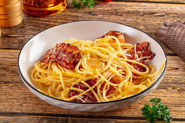 Italian classic spaghetti carbonara with bacon and egg