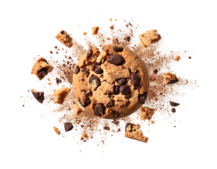 A chocolate chip cookie surrounded by crumbs, captured against a black background
