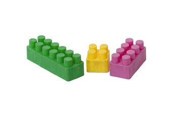 Three Colorful Plastic Construction Blocks on Transparent Background