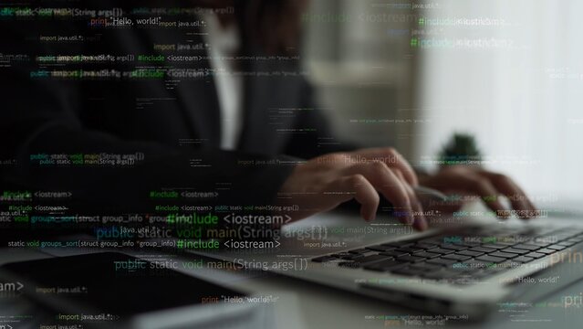 A focused programmer types on a laptop, immersed in software development, highlighted by lines of code illuminating their creative workspace in a modern office setting. Xenic