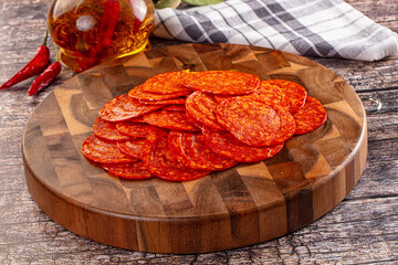 Spicy hot pepperoni sausages slices