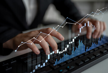 A business professional engages in data analysis, using a digital keyboard with a graphical display of growth trends to drive informed decision-making in a modern office environment. Scalp