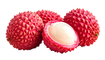 Close-up of several vibrant red, textured fruits, one cut open to reveal white flesh