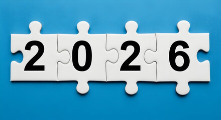 The year 2026 is written on puzzle pieces, symbolizing future planning and problemsolving concept